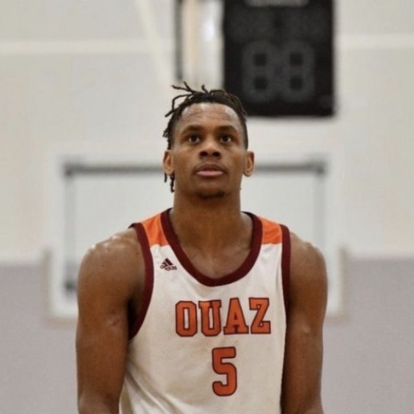Coach Devin Collins in his Ottawa University Arizona #5 jersey on the court